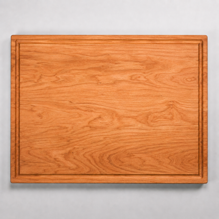 Wooden cutting board on a gray background