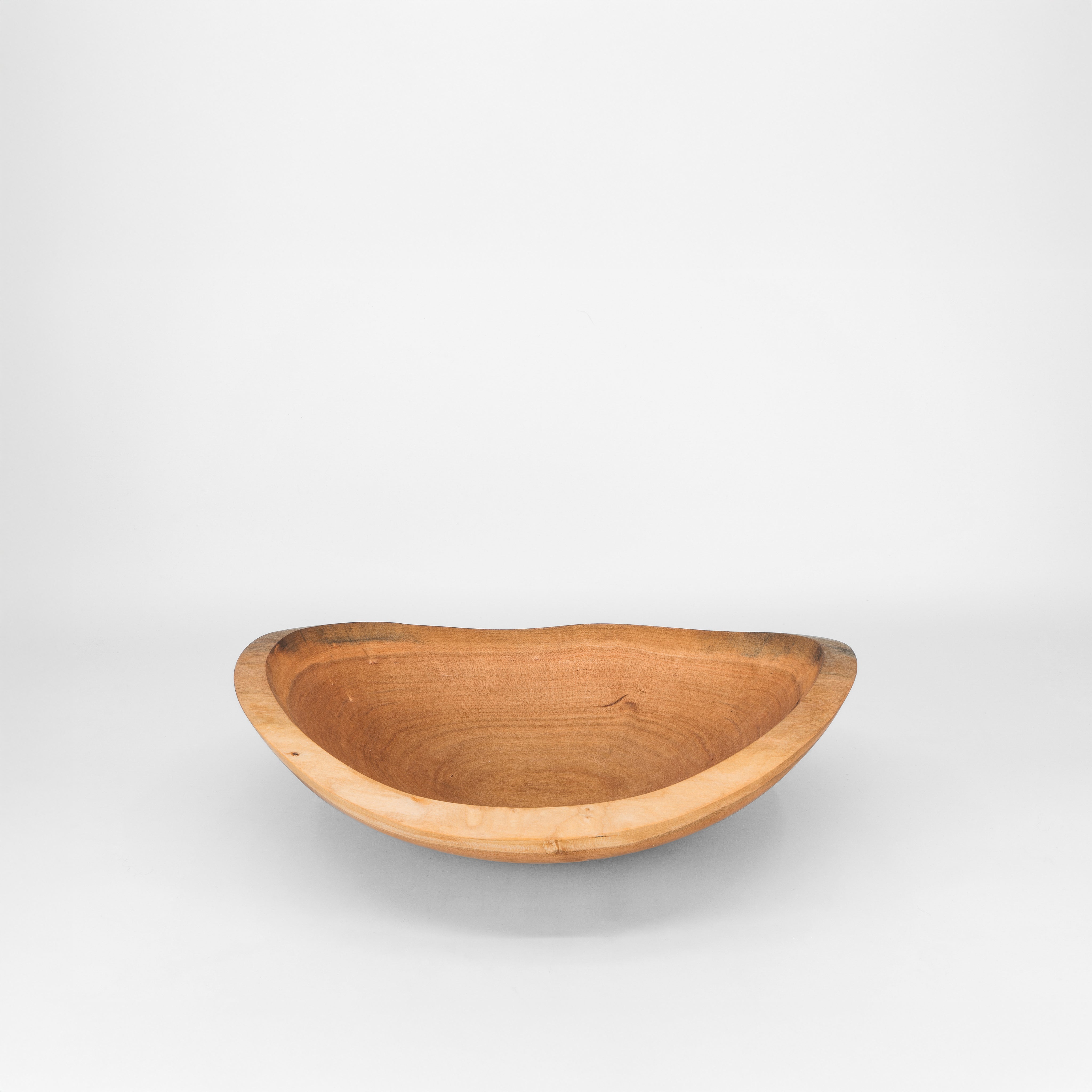 Wooden bowl on a grey background