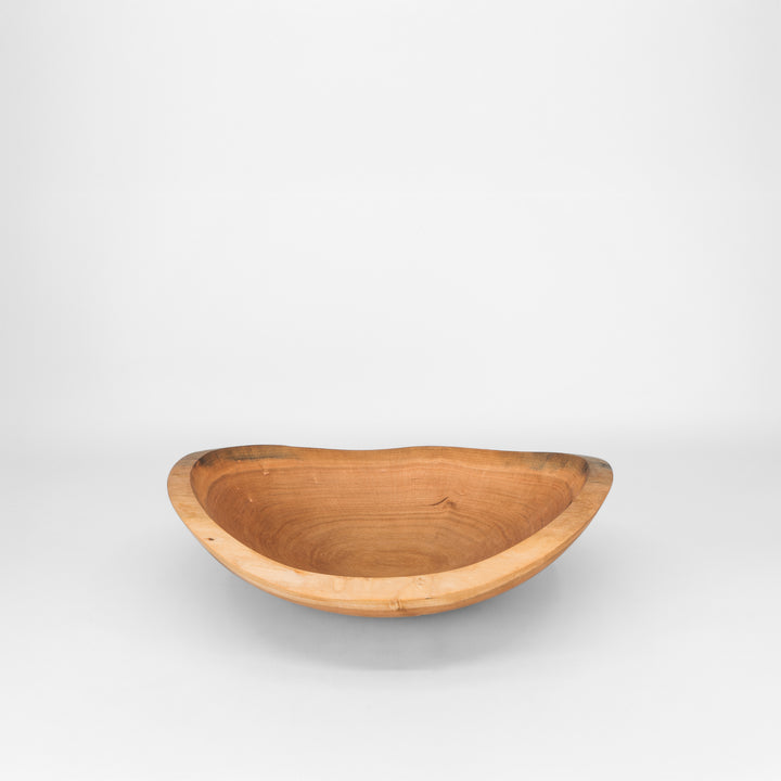 Wooden bowl on a grey background