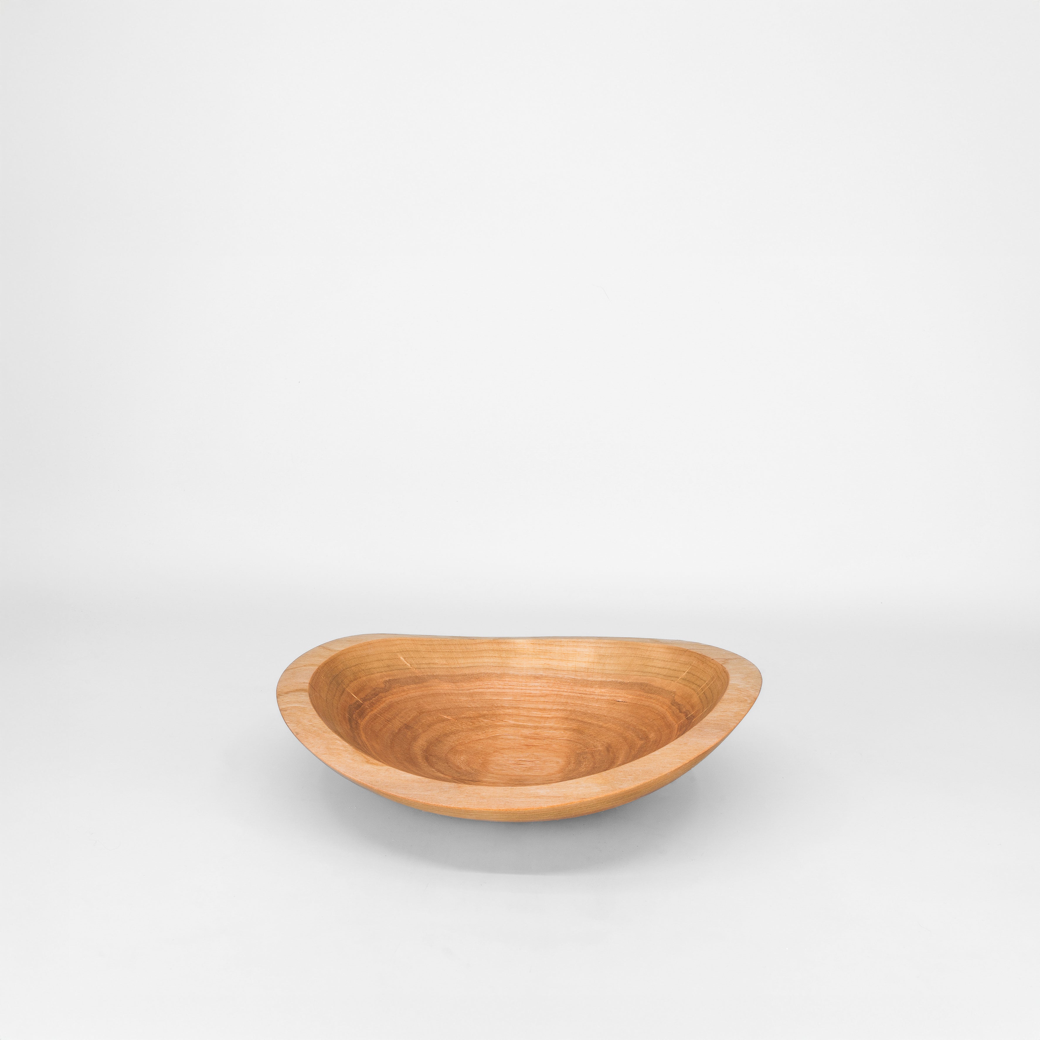 Wooden bowl on a grey background