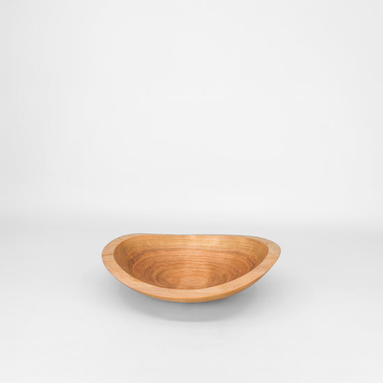 Wooden bowl on a grey background