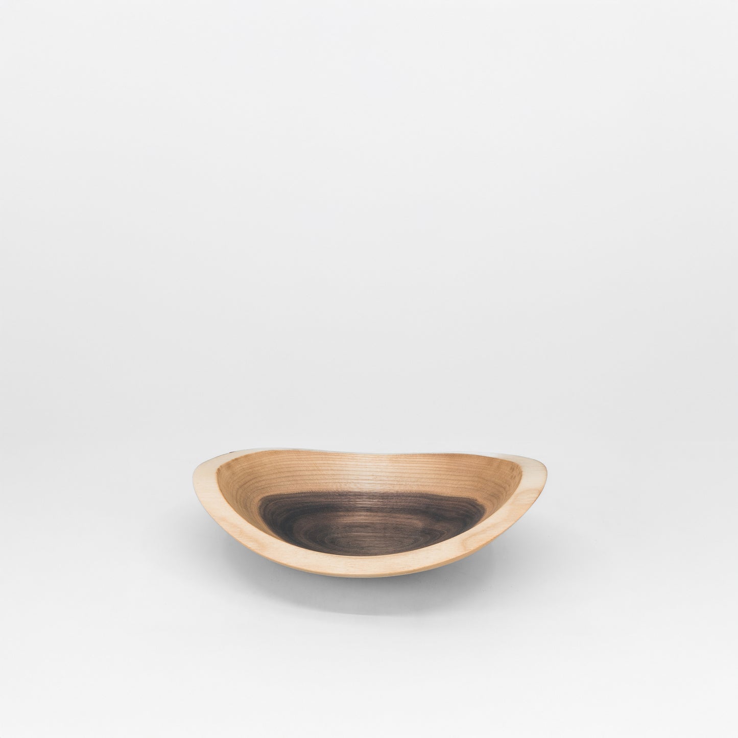 Wooden bowl on a grey background