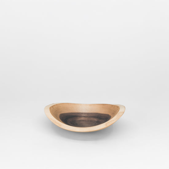 Wooden bowl on a grey background