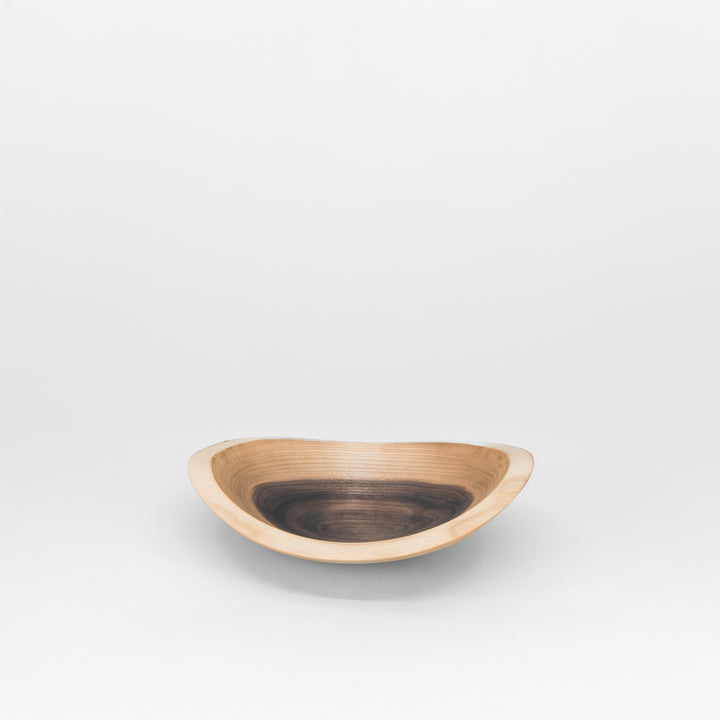 Wooden bowl on a grey background
