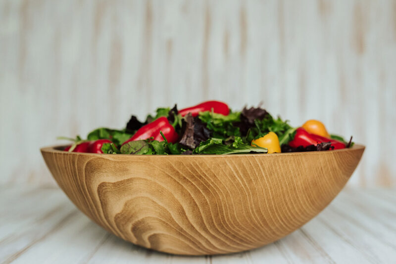 17 inch wooden Beech Bowl holding a freshly made salad.
