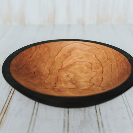 The craftsmen turn this spectacular solid 9-inch Ebonized bowl at the Holland Bowl Mill, one of the last commercial wood bowl mills in production in the United States.