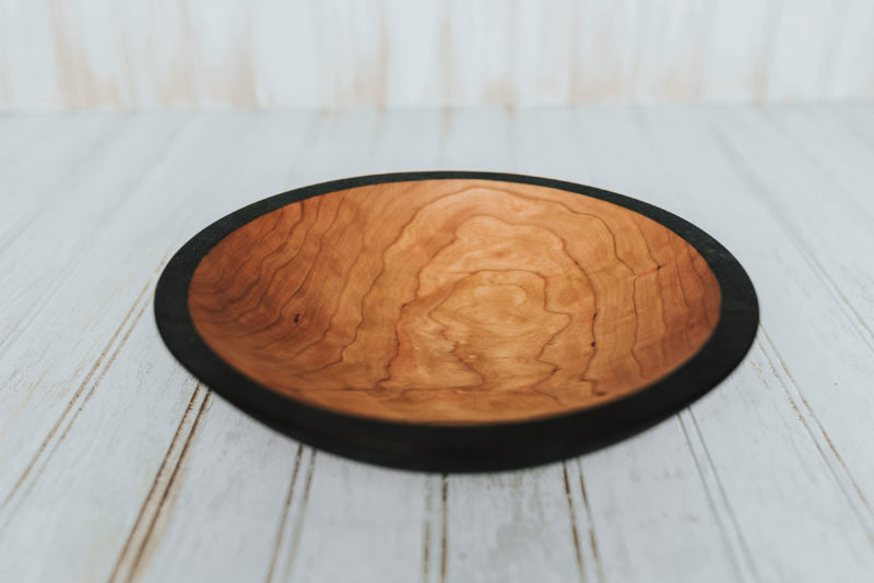 The craftsmen turn this spectacular solid 9-inch Ebonized bowl at the Holland Bowl Mill, one of the last commercial wood bowl mills in production in the United States.