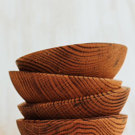 7 inch torched red oak bowls in a stack.