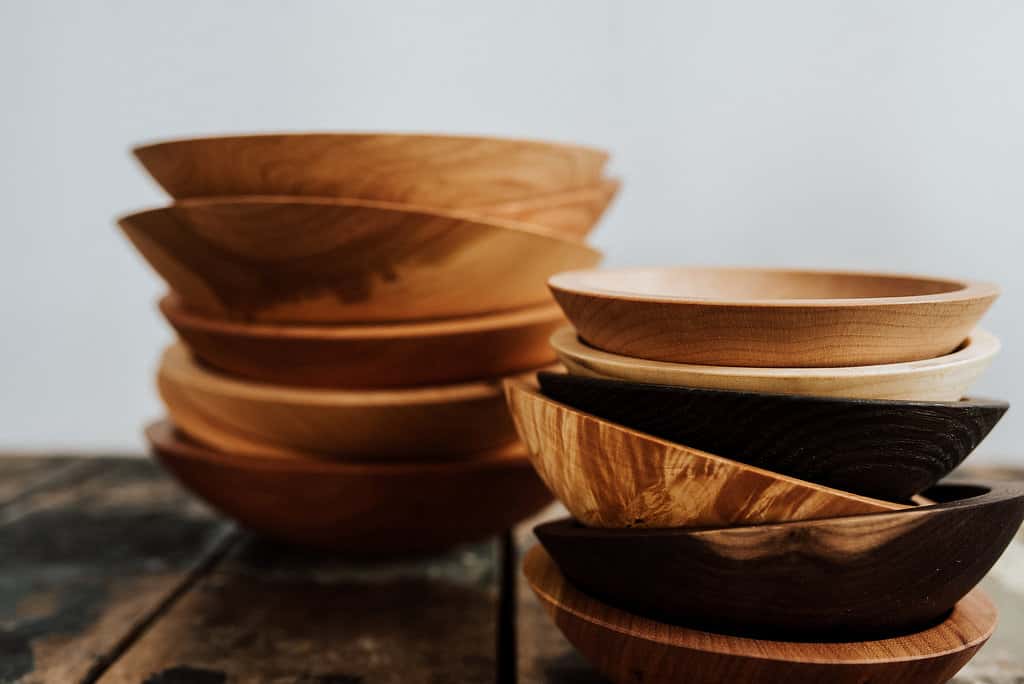 A group of decorative wooden bowl stacks.