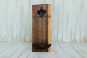 Wooden Wall mounted bottle openers in a walnut finish.