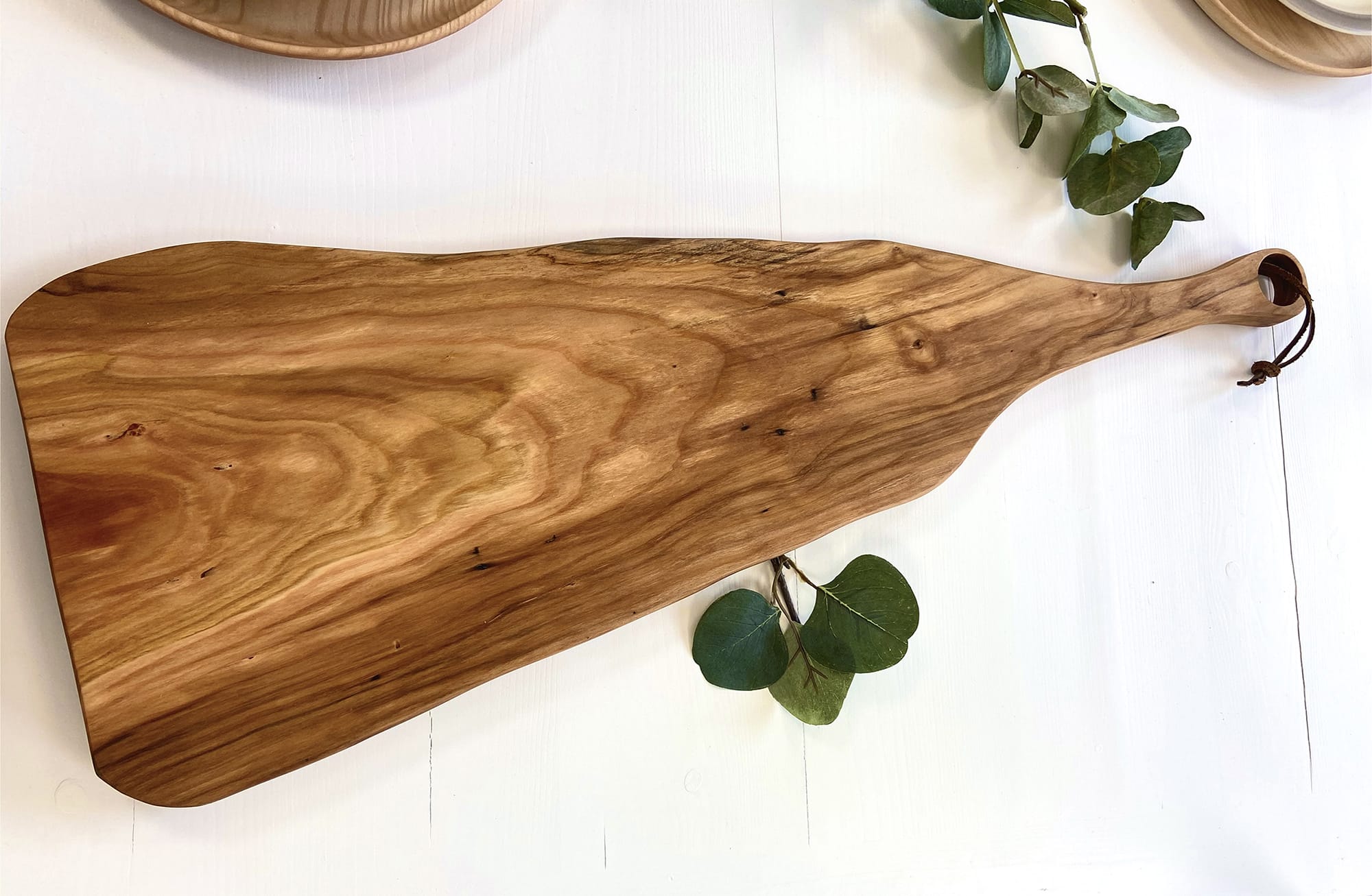 A clean long cutting board by Holland Bowl Mill, before any knife marks on wood cutting board appear.