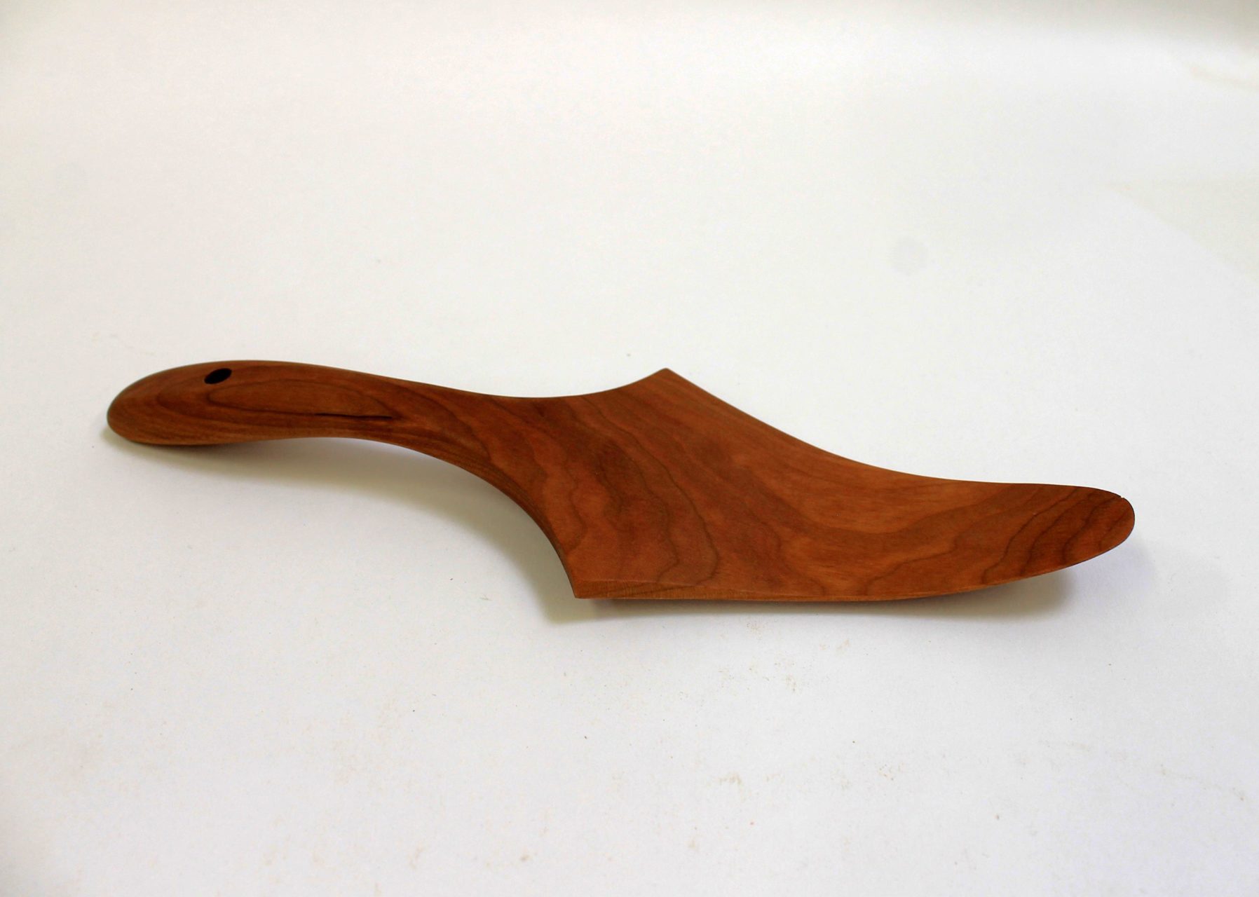 A wooden pie server made from Cherry wood.