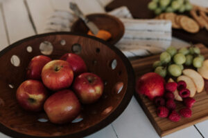What is a fruit bowl? Fruit bowls have holes cut into them at strategic locations to ensure fruit lasts longer and doesn't droop or bruise. Six apples in a dark walnut fruit bowl.