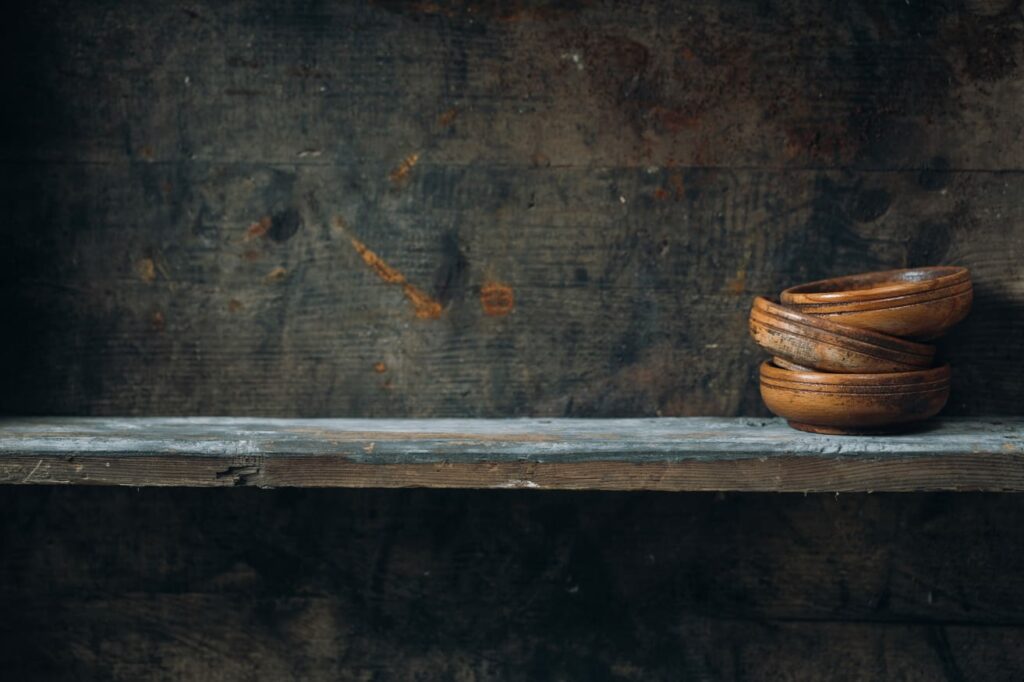 Old wooden bowl on a shelf.